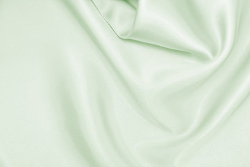 Draped satin green fabric for festive backgrounds