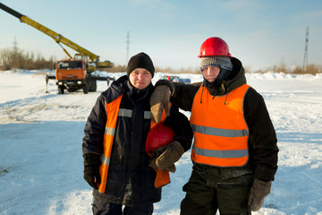 Fototapeta na wymiar Two workers at the site of the ice camp