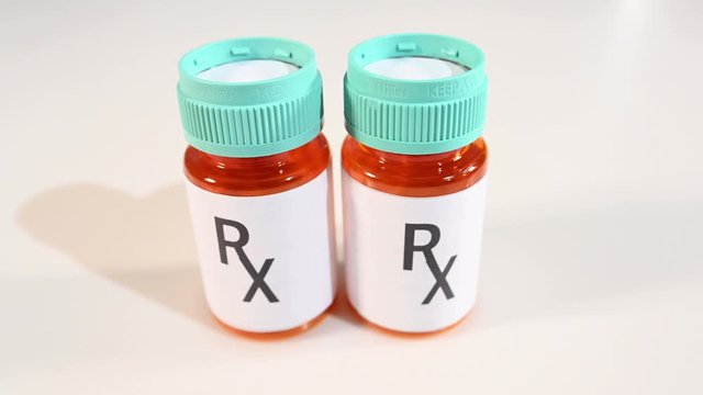 Pharmaceutical industry drug duplication.  Generic RX label bottles.  Prescription bottles
