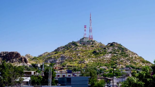 Iconic "Cerro de la Campana" hill in the mexican northern city of Hermosillo, Sonora with a cell phone and tv antenna