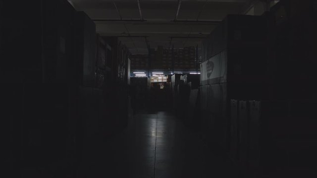 Lights Opening One By One In A Storage Warehouse