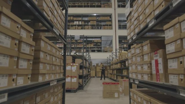 Wide Shot Of Piled Boxes In A Storage Warehouse