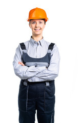 Toothy smiling business woman wearing a building helmet. Young girl. Isolated