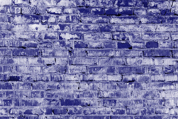 Old brick wall texture close up. Abstract background blue color toned