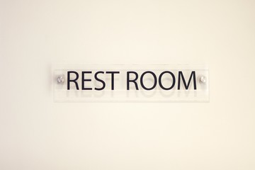 Sign shows towards the rest room with large text