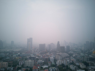 Fototapeta na wymiar PM2.5 air pollution in the capital, Bangkok, with fog light to come into the building