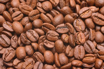 Background of roasted coffee beans photographed from above in close-up