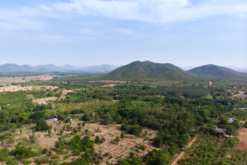 Drone shot aerial view scenic landscape of agriculture farm against mountain and nature forest