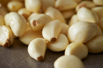 Peeled garlic background, studio shot 