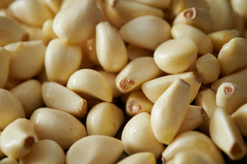 Peeled garlic background, studio shot 