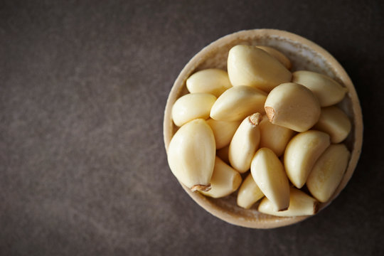 Peeled garlic background, studio shot 