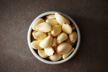 Peeled garlic background, studio shot 