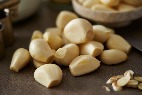 Peeled garlic background, studio shot 