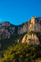 Fototapeta na wymiar BARCELONA, SPAIN - December 26, 2018: The mountains of Montserrat in Barcelona, Spain. Montserrat is a Spanish shaped mountain which influenced Antoni Gaudi to make his art works.