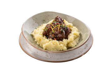 Plate of Goulash Stroganoff isolated on white background with mashed potato