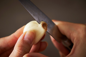 Garlic with knife, studio shot 