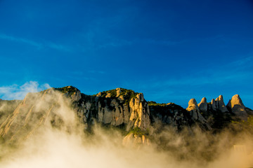 BARCELONA, SPAIN - December 26, 2018: The mountains of Montserrat in Barcelona, Spain. Montserrat  is a Spanish shaped mountain which influenced Antoni Gaudi to make his art works.