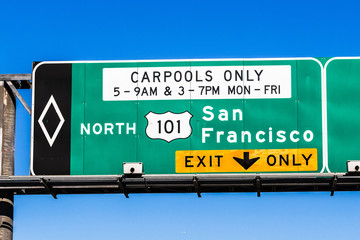 Freeway 101 northbound to San Francisco signage providing directions and the applicable carpool rules; San Francisco bay area, California