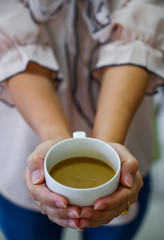 Coffee cup in woman hand