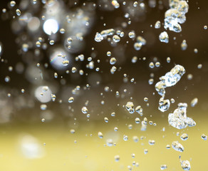 Water splashing from a fountain on summer nature
