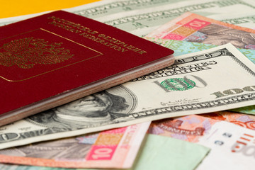 Russian passport on heap of money close up
