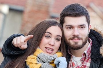 Young couple enjoying outdoors in urban surroundings.