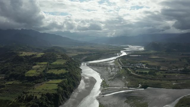 Aerial drone shot of river in Yuli Taiwan with bridge