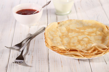 Thin pancakes with strawberry jam