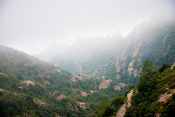 Fototapeta premium BARCELONA, SPAIN - December 26, 2018: The mountains of Montserrat in Barcelona, Spain. Montserrat is a Spanish shaped mountain which influenced Antoni Gaudi to make his art works.