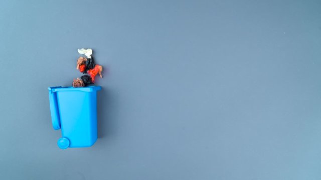 Stop motion of waste paper in and out from trash can