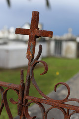Oxidized cross on cemetery - 316942738