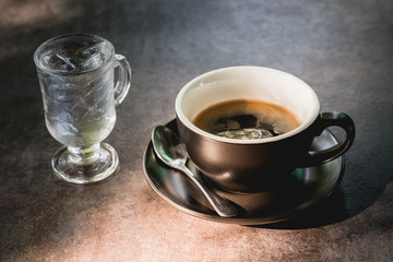 hot coffee in cup and light