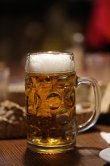 glass of beer on wooden table