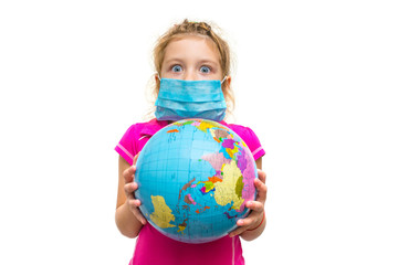 Frightened little girl in a medical mask holds a globe in her hands. Surprised baby eating isolated on a white background. Children's ecology concept of environmental protection from pollution.