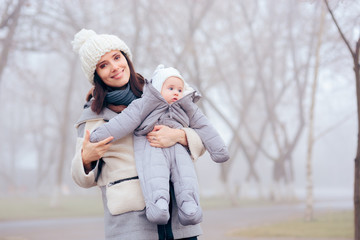 Mother Taking Baby Out for a Walk in Winter 