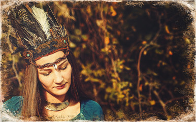 beautiful shamanic woman with headband in the nature.