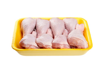 Chicken shin in yellow tray isolated on white background. Raw poultry meat
