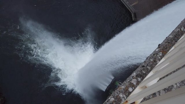 Water reservoir with the sluice open by pouring the water back to the riverbed. industrial concept