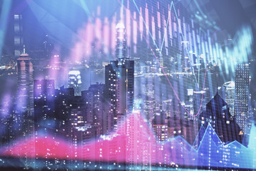 Obraz premium Double exposure of forex chart drawings over cityscape background. Concept of success.