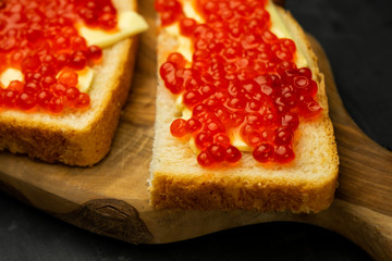 sandwich with butter and red caviar