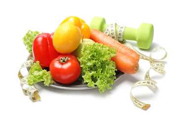 Different healthy food with measuring tape and dumbbells on white background. Diet concept