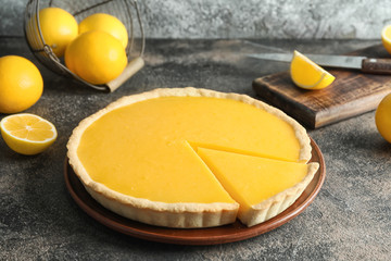 Tasty homemade lemon pie on table