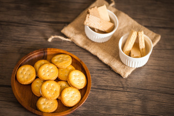 Dessert biscuit and cracker sweet food in coffee time put on the wood plate and wood table 