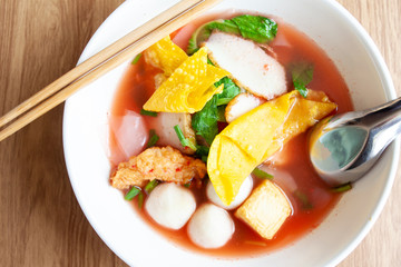 Asian noodle call Yentafo noodle with meat ball tofu and pork  with red soup 