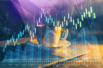 Double exposure of chart and financial info and work space with computer background. Concept of...