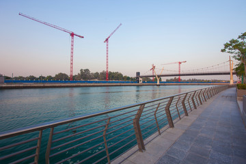 Obraz premium silhouette of construction cranes, industrial photo. Dubai, UAE