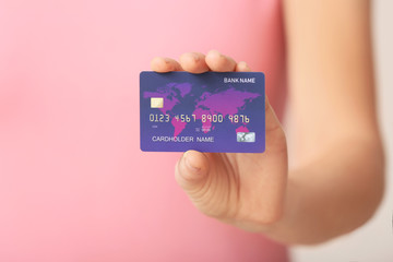 Young woman with credit card, closeup