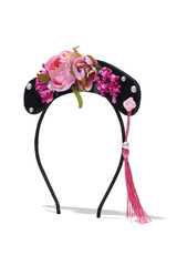 Subject shot of a headband made as a black elongated crest with hotpink flowers, pearls and a crimson tassel with a pearl bead. The stylish headband is isolated on the white background with shadows.