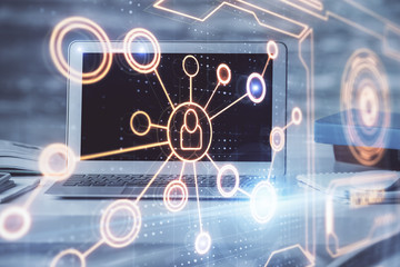 Computer on desktop with social network theme icon. Multi exposure. Concept of international connections.