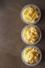 Crushed garlic in plastic bowl 
